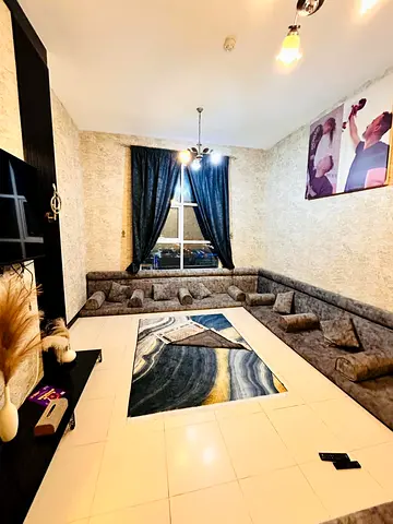 A prime investment and residential opportunity for sale in City Towers, Ajman: a two-bedroom apartment with a living room and a full, direct view of t