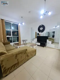Furnished one-bedroom apartment for rent in Ajman with a living room, prime location on Khalifa Stre