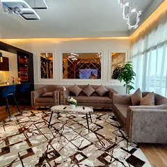Luxury two-bedroom apartment with a living room – sea view, prime location, elegant design, and a 