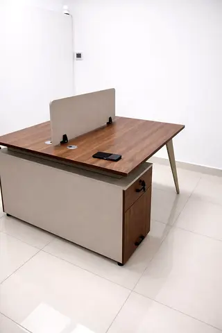 Two-person wooden office workstation with divider and storage pedestal