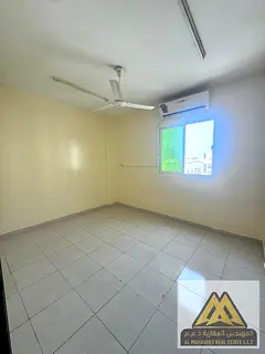 Two-bedroom apartment with a living room and balcony, separate living area, close to Dubai exit, wit