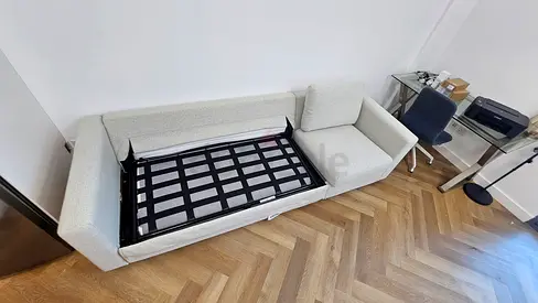 Pulled out 3-seat sofa-bed with mattress
