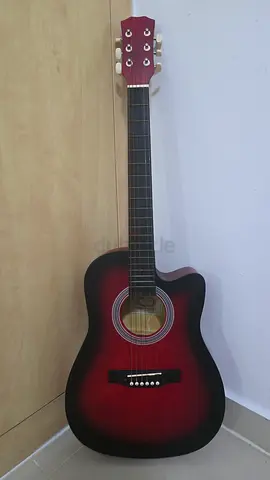 4/4 full size acoustic guitar with bag and pick.