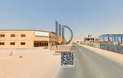 A prime industrial plot located in Al Jurf Industrial 2, ideal for manufacturing facilities, warehou