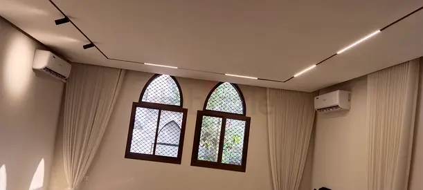 Elegant Ceiling with Modern Lighting and Curtains