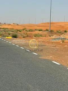 Opportunity (281) Land for sale in Al Qasimia City, Phase 1, with 3 shops built on it. On an area of