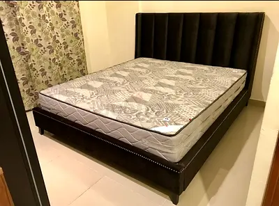 Dark brown upholstered King bed frame with mattress from THE ONE