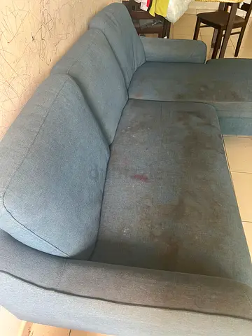 L-shaped fabric sofa (used) — needs cleaning
