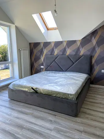 New Grey upholstered bed with geometric headboard