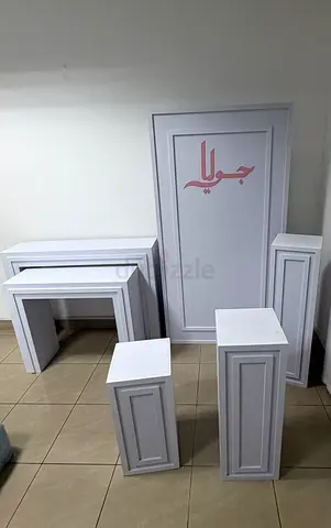 White tables and stands for new baby decoration or birthday party decoration