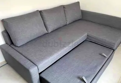Gray L-shaped Sofa with Pull-out Bed - Good Condition