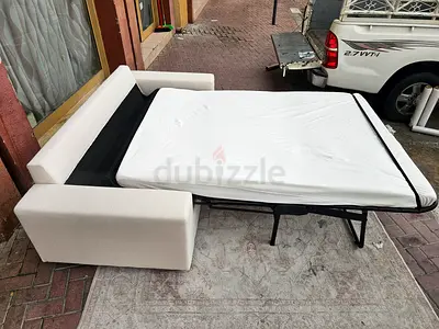 Beige Ikea Two seater wide arm sofa bed