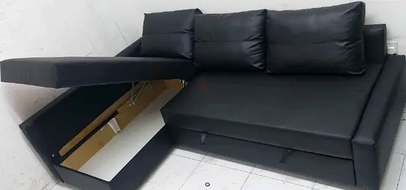 Black L-shaped convertible sofa bed with storage