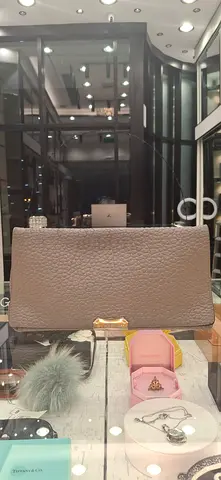 Taupe pebbled leather clutch — gently used