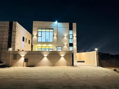 Villa for sale with a swimming pool and front setback - registration and ownership fees included - near Sheikh Mohammed Bin Zayed Road - freehold owne