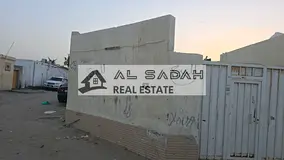 Corner house for sale in Umm Khanoor, with 3 bedrooms, living room, kitchen, and majlis. Area: 2500