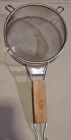 Steel seive with wooden handle