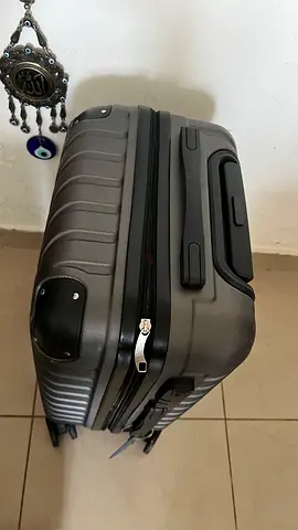 Grey hard-shell 4-wheel roller luggage (good condition)