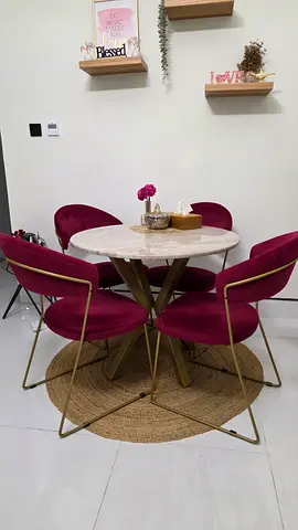 Round marble-look dining set with 4 burgundy velvet chairs and 2 matching ottomans