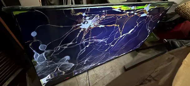 Broken flat-screen LED TV — cracked screen, for parts/repair