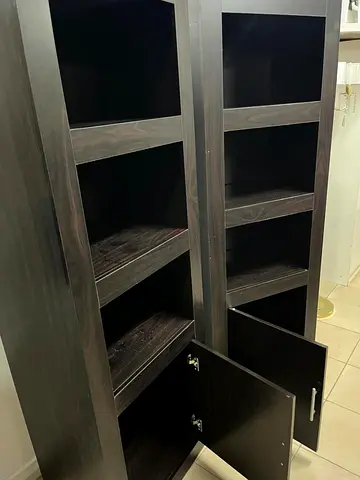 Dark wood-colored bookcases, from Ban Emirates Delin