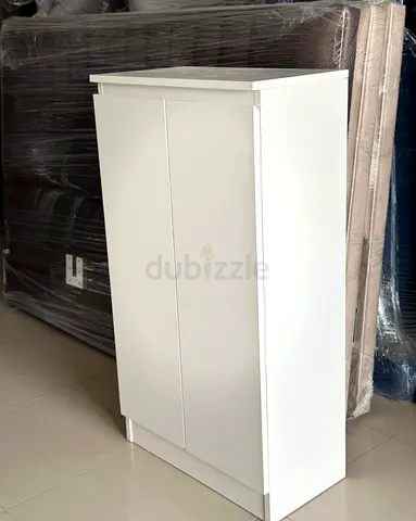 Compact white 2‑door shoe rack / storage cabinet