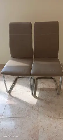 Set of 2 brown faux-leather dining chairs with chrome sled legs