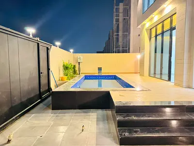 Villa for sale with a swimming pool and front setback - registration and ownership fees included - near Sheikh Mohammed Bin Zayed Road - freehold owne