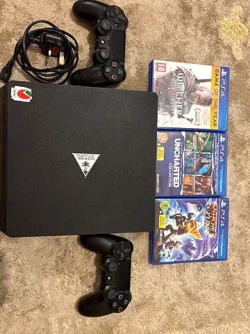 PS4 Slim 500GB + 2 Controllers + Games (Excellent Condition)