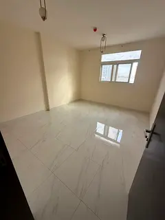 Two-bedroom apartment with a living room for annual rent in Al Jurf 3, Ajman, featuring