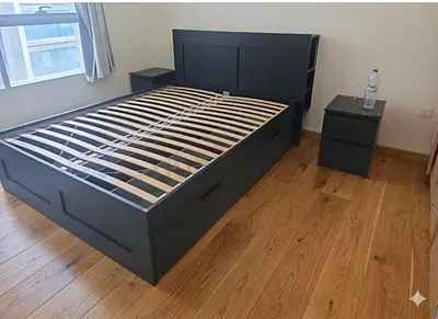 IKEA Bed Frame with Side Tables – Good Condition • Modern black design • Strong wooden frame • Inclu
