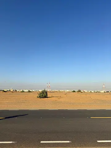 **Prime Land for Sale in Al Suja’a – Multiple Permits & Strategic Location**