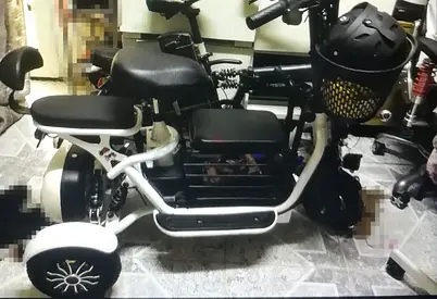 Electric three wheeler scooter