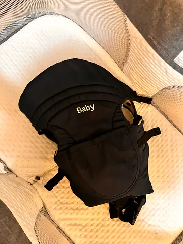 My black baby front carrier — good condition
