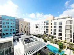 Spacious luxurious huge size studio apartment with open window and swimming pool view