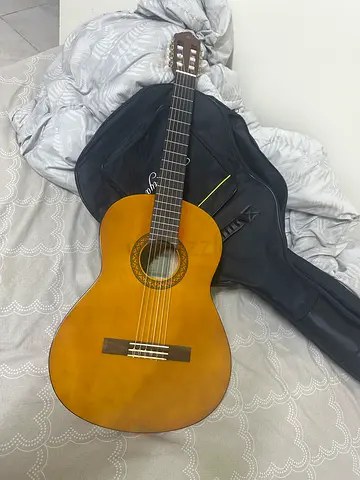 Classical nylon-string acoustic guitar with gig bag