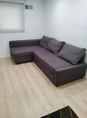 My grey L-shaped sofa bed with chaise - good condition