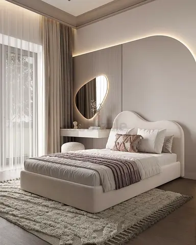 My cream upholstered bed with curved headboard