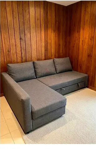 My grey L-shaped sofa bed with chaise — good condition