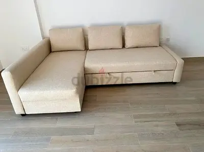 My beige L-shaped sofa bed with  storage chaise - good condition