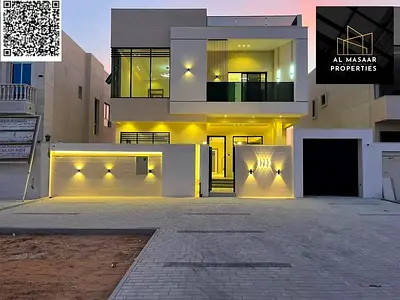 فيلا فاخرة بتصميم مودرن للبيع على شارع الرئيسى طابقين و رووف ارتداد امامى 12 مترا فى منطقة الزاهية، عجمان