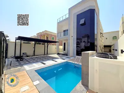 Enjoy the luxury of a luxurious villa for sale in Al Rawda 3, Ajman, 5 rooms with pool, freehold and bank financing