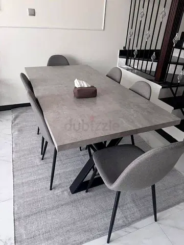 Selling great condition dining table with six chairs home Center