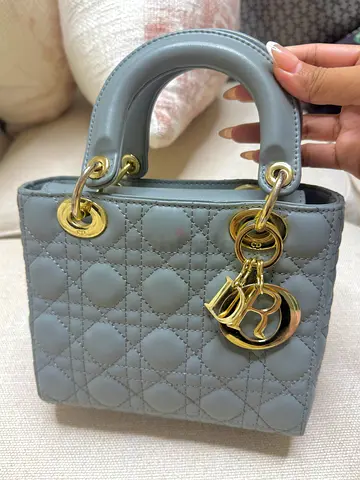 Grey quilted mini handbag with gold-tone hardware (gently used)