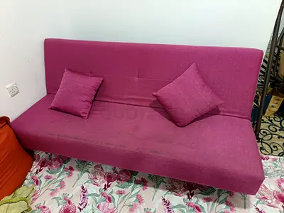 Magenta fabric futon sofa (converts to bed) - used