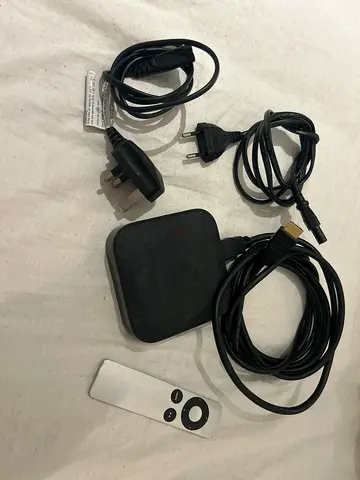 Apple TV media streamer with remote, HDMI cable and power adapter