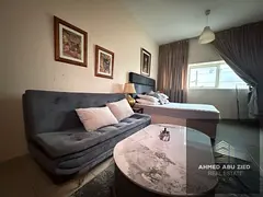Fully furnished studio for annual rent in Rashidiya 3, Ajman One Towers. Spacious layout, central AC