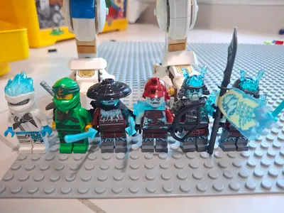 My LEGO Ninjago minifigures and mech lot — ice warriors, Lloyd  weapons