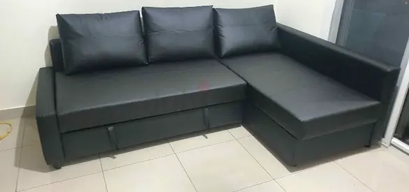 Black L-shaped Faux Leather Sofa bed with Chaise - Good Condition