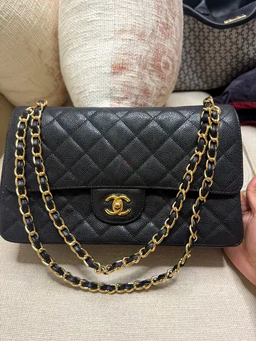 Black quilted leather chain-strap shoulder bag with gold hardware